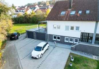 Familienidyll: Großzügiges Haus mit Garten, 2 Garagen und E-Ladestation in Top-Lage!